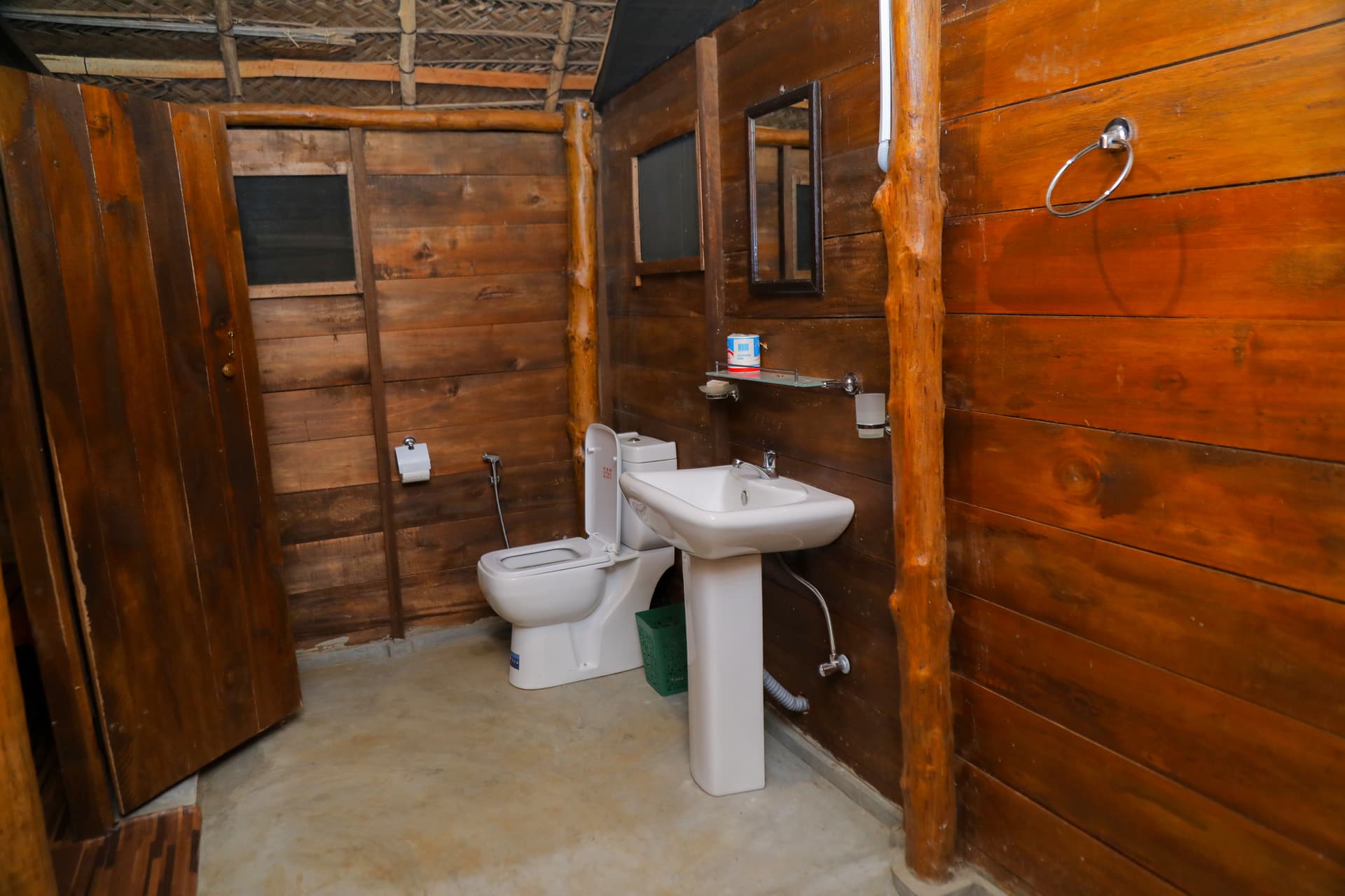 A clean, modern walk-in shower and bathroom with consistent rustic wooden aesthetics — where comfort meets nature.